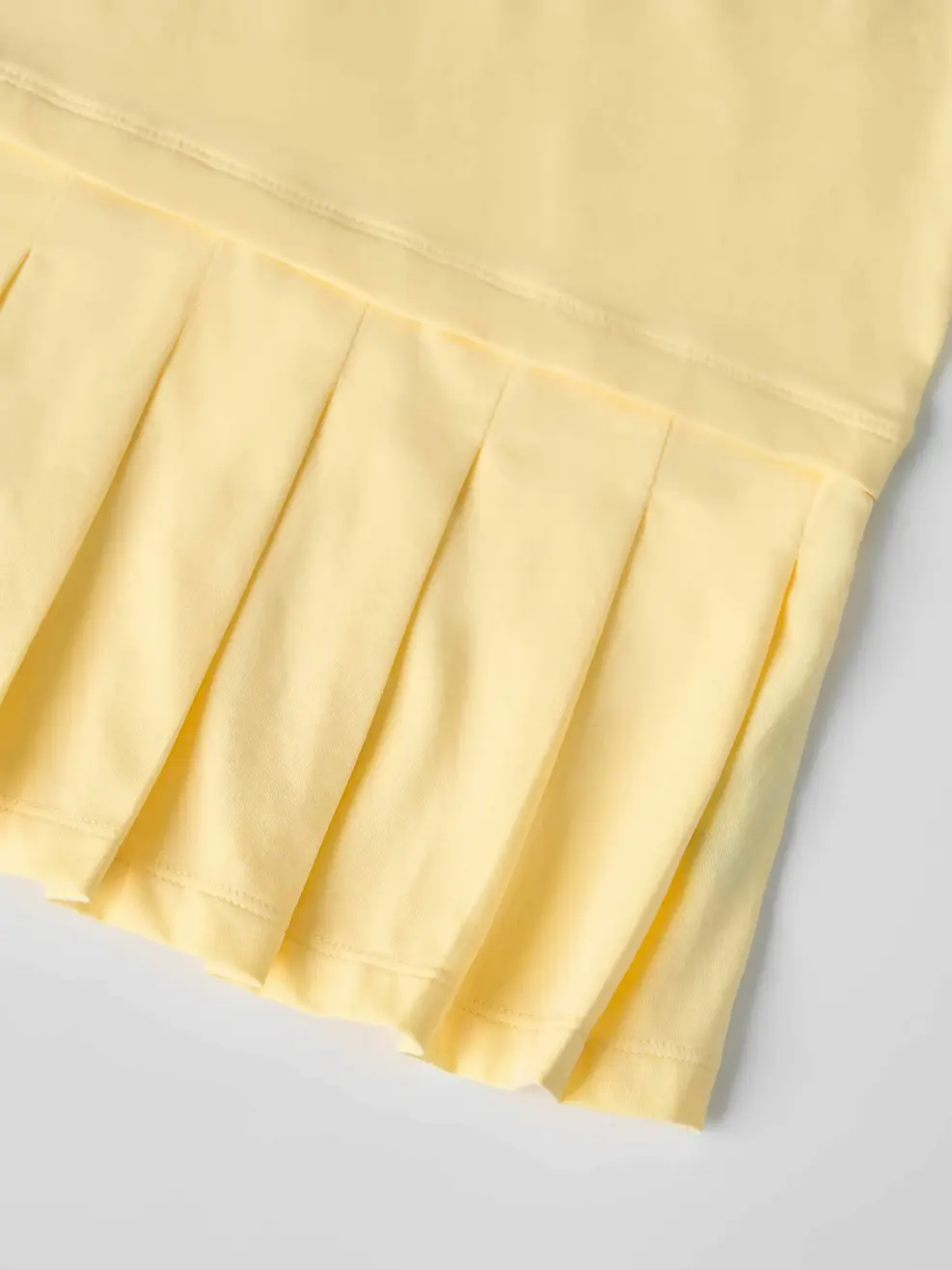 Váy bé gái xếp li cổ polo - Màu vàng 008 - 110